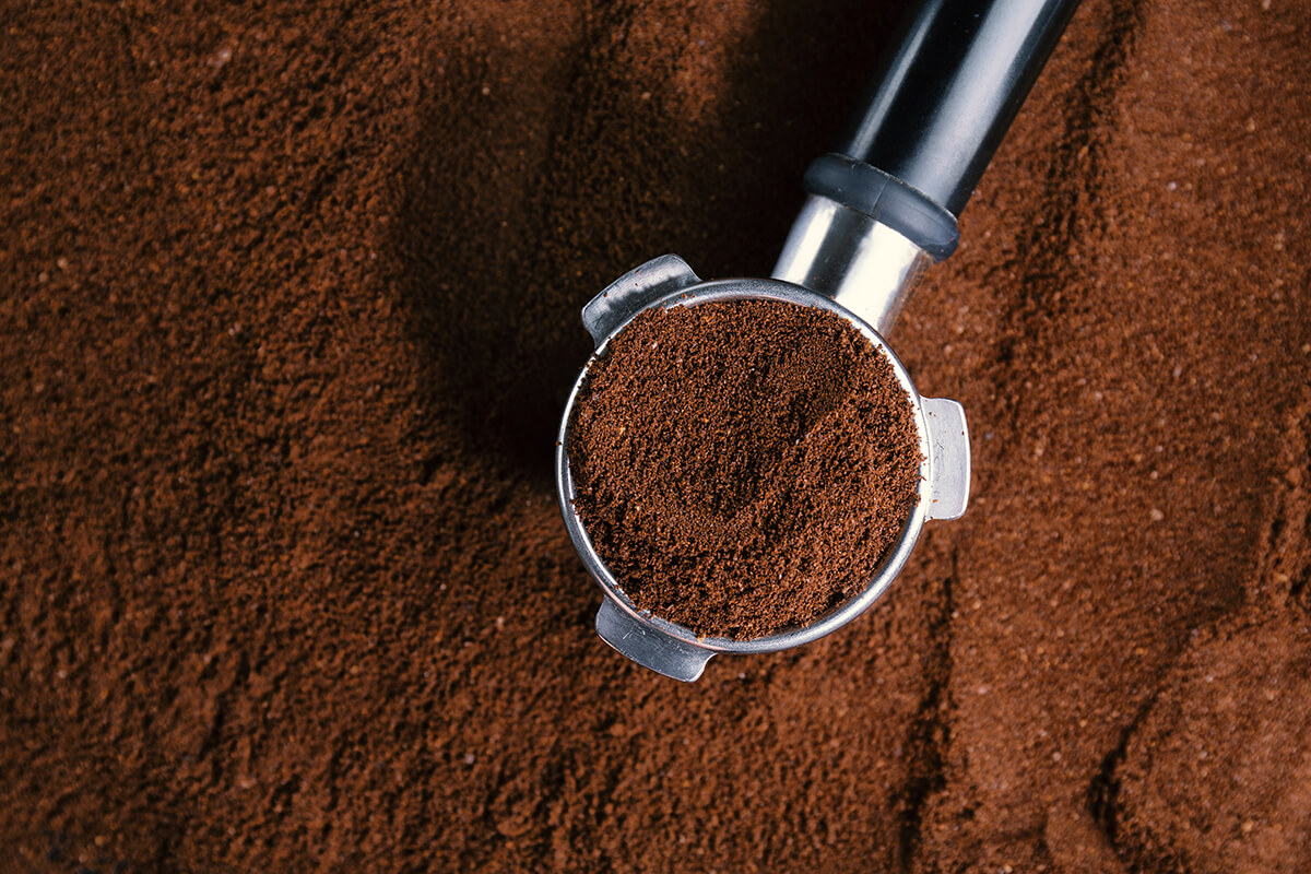 coffee-background-coffee-automatic-from-machine-with-ground-coffee-coffee-background-closeup (1).jpg